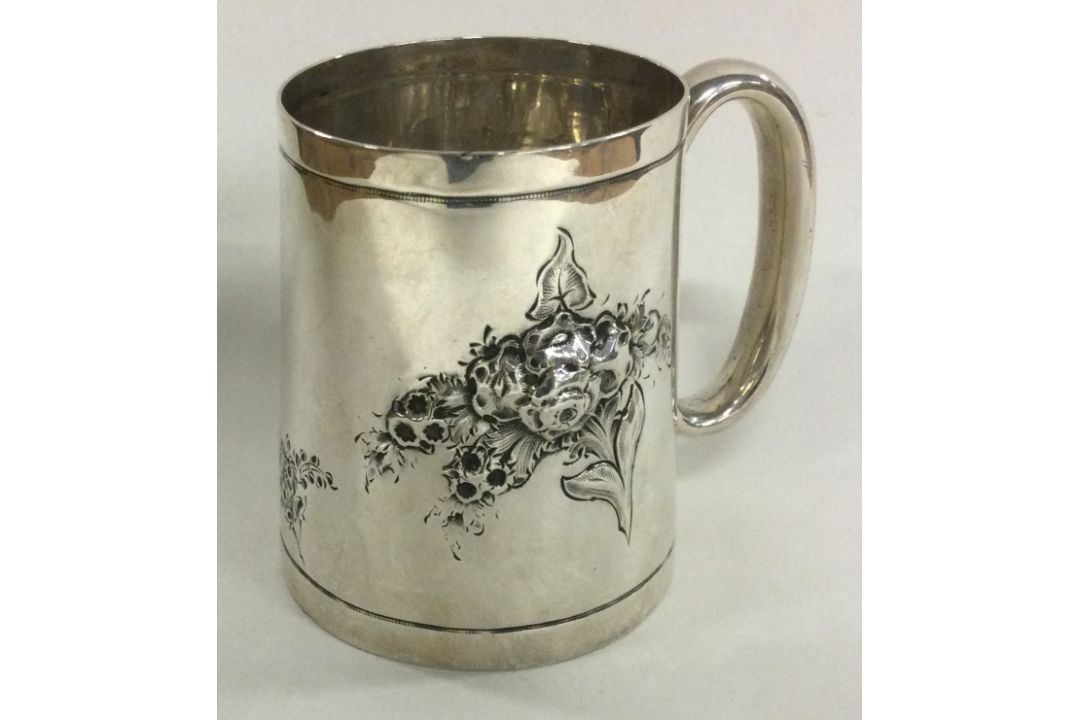 A novelty Victorian silver christening mug chased with flowers. London 1882. By Martin Hall & Co. - Image 2 of 2