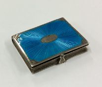 A silver and blue enamelled snuff box in the form of a book.
