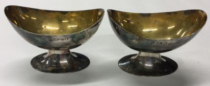 A pair of 19th Century Indian Colonial silver salt cellars with gilt interiors.