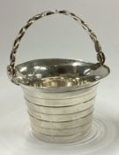 An 18th Century George II silver cream pail.