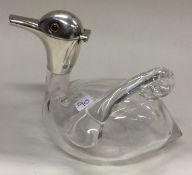 A novelty Victorian silver and glass claret jug in the form of a duck.