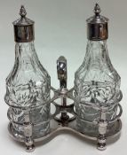 An early 18th Century Queen Anne silver oil and vinegar cruet.