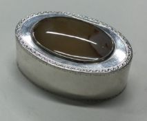 An 18th Century George III silver snuff box with agate stone to lid.