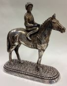 A large silver figure of a jockey on horse, inscribed 'Sheldon'.
