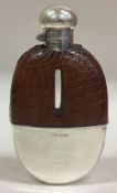 A large Victorian silver mounted glass and leather flask with screw-top lid.