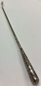 WANG HING: A Chinese silver hook.