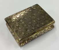 An 18th Century silver snuff box engraved with shells.