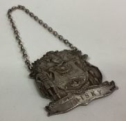 An unusual silver wine label for 'Whisky'.