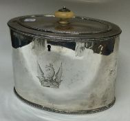 An 18th Century George III silver tea caddy with crested dragon to centre.