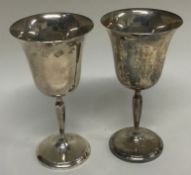 A pair of silver goblets.