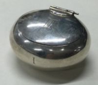 A silver hinged pill box.