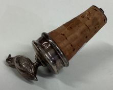 A silver bottle stopper cast with grouse.