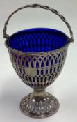 An 18th Century George III silver swing handled basket with pierced decoration.