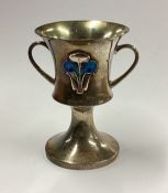 An Art nouveau silver and enamelled cup.