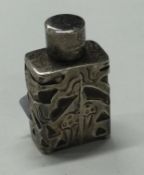 A pierced silver scent bottle with screw-top lid.