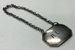 An 18th Century George III silver wine label for 'Rum'.