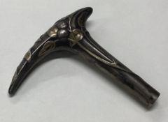 A rare 19th Century American mixed metals walking stick handle.