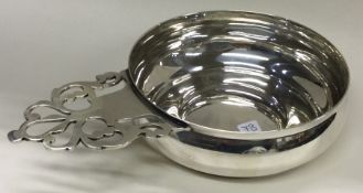 TIFFANY & CO: A silver wine taster.