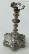 A Victorian silver taper stick.