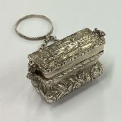 A rare novelty 19th Century Victorian silver vinaigrette in the form of a handbag.