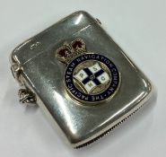 CHESTER: A silver vesta case with enamelled plaque to centre.