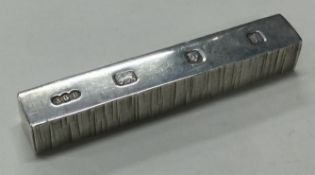 GERALD BENNEY: A silver bar.