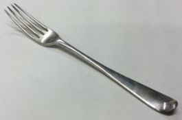 An 18th Century silver four prong fork.