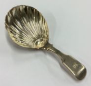 A heavy William IV silver fluted caddy spoon.