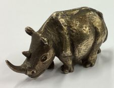 STUART DEVLIN: A cast silver figure of a Rhino.