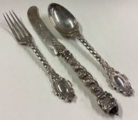 A rare three-piece Victorian silver christening set with spiral handles.