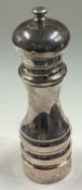 A large silver pepper mill.
