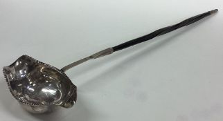 A Georgian silver toddy ladle with whalebone handle.