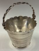 A silver cream pail in the Georgian style.
