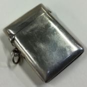 A heavy plain silver vesta case.