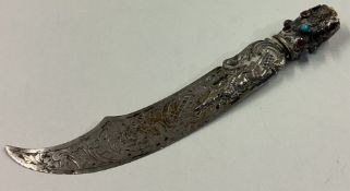 A Continental silver letter opener in the form of a sword with blue stones.
