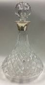 A large silver mounted decanter with stopper.