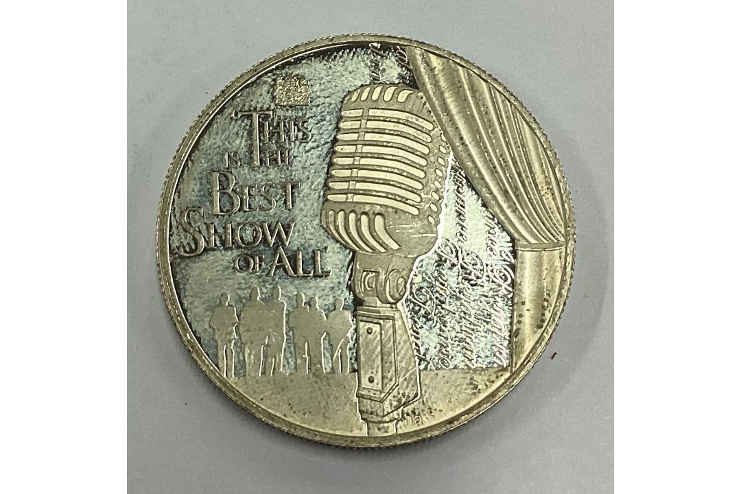 A silver Elizabeth II Five Dollar coin. - Image 1 of 2