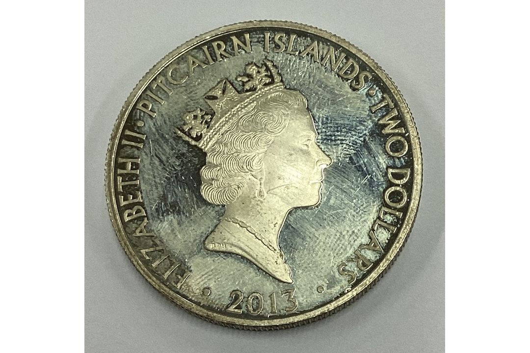 A silver Elizabeth II Five Dollar coin. - Image 2 of 2