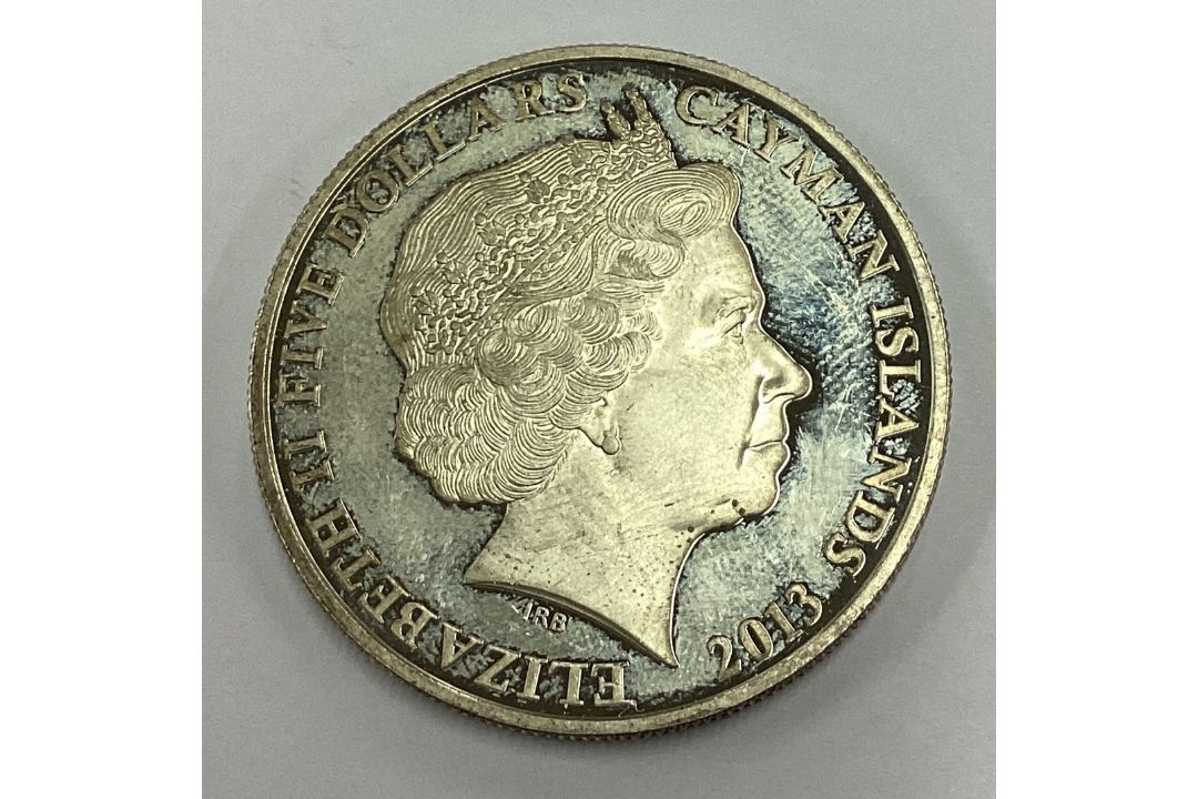 A silver Elizabeth II Five Dollar coin. - Image 2 of 2