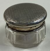 A silver mounted and glass engine turned box with lift-off cover.