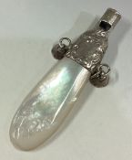 A silver and MOP rattle.