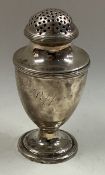A George III silver caster.