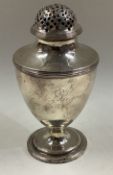 An 18th Century Georgian silver sugar caster.