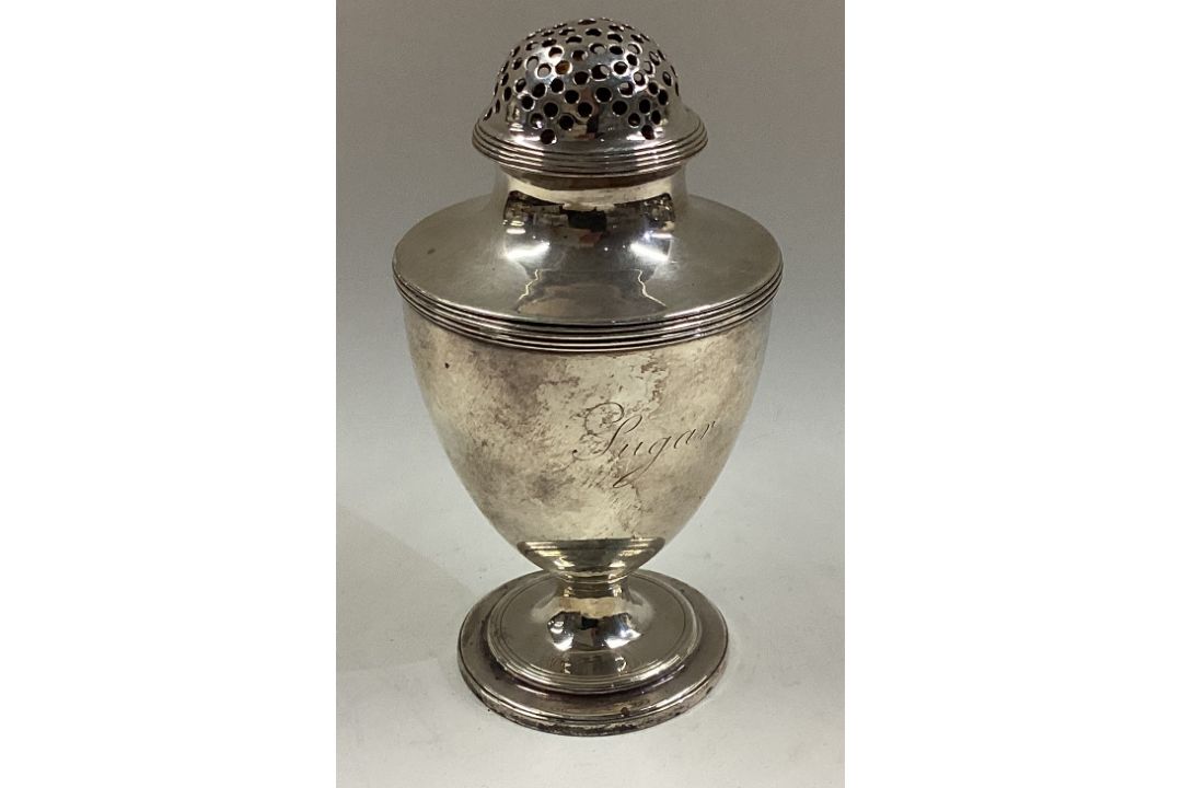 An 18th Century Georgian silver sugar caster.