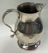 A good heavy silver cream jug in the Georgian style.