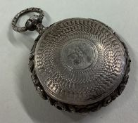 A good quality circular Georgian silver vinaigrette with chased decoration.