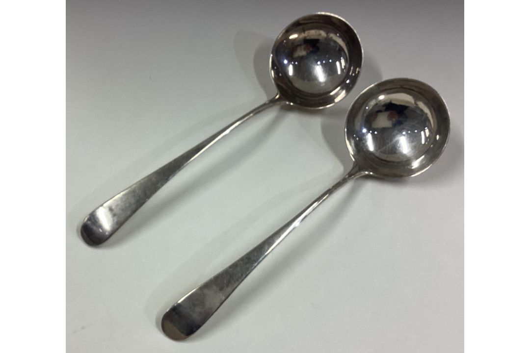 A pair of Georgian silver sauce ladles. - Image 1 of 2