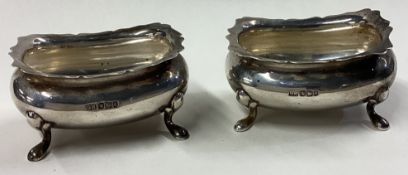A pair of heavy Edwardian silver salts.