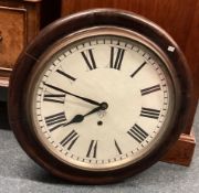A small oak framed wall clock.