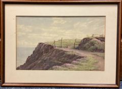 CHARLES H BRANSCOMBE: (British, 1858 - 1924): A framed and glazed watercolour of a coastal path.